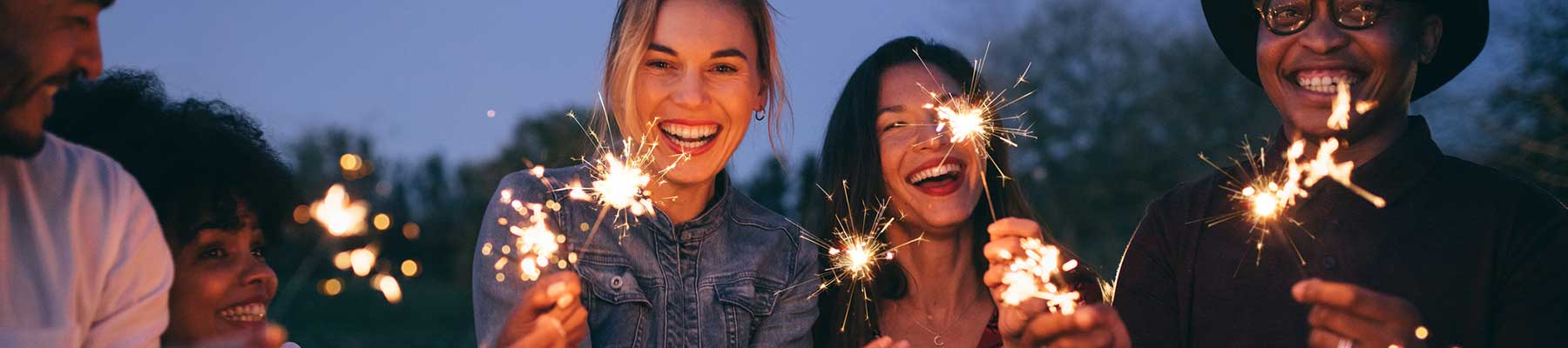 Group of friends enjoying out with sparklers